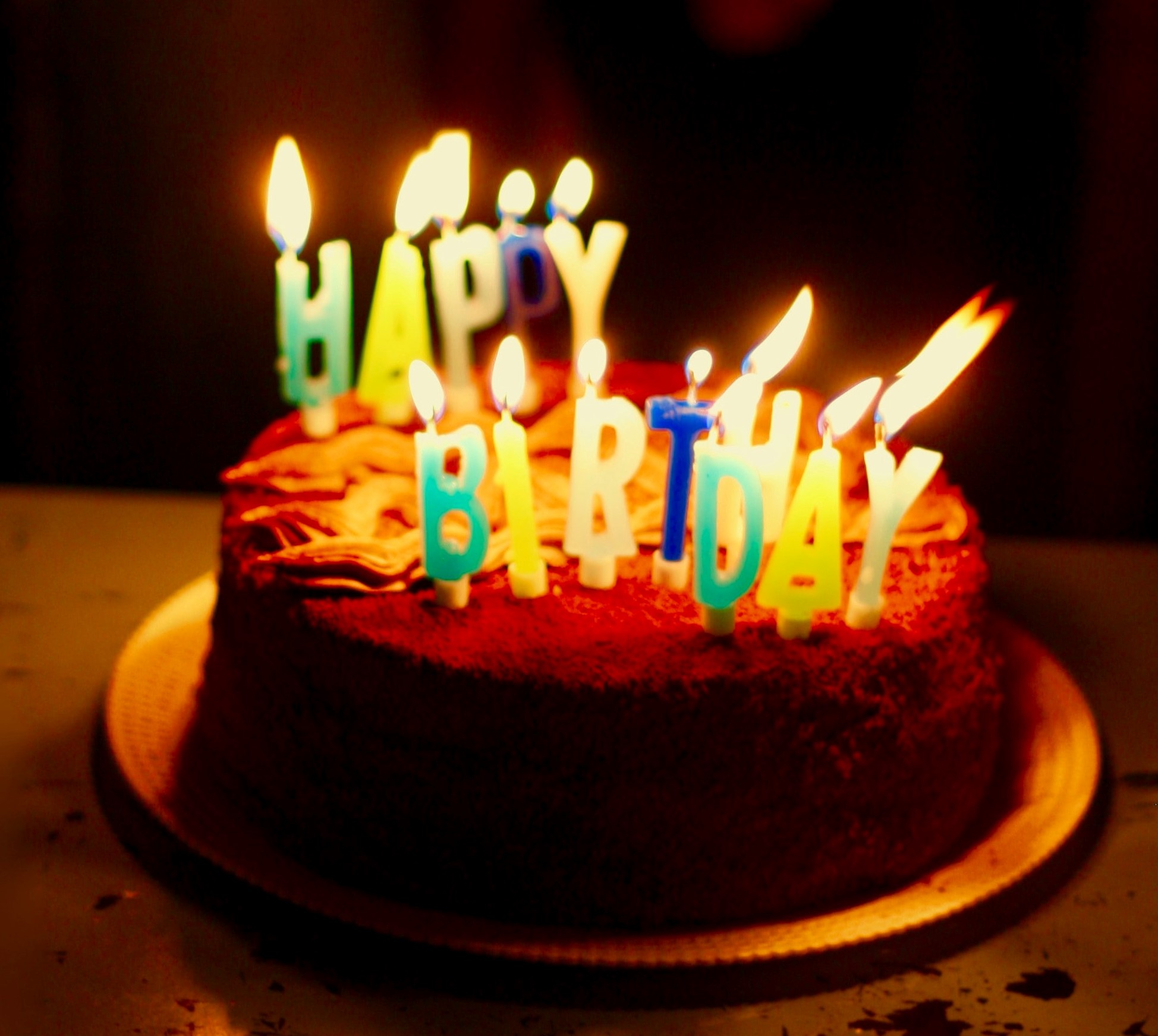 Birthday cake with lit candles